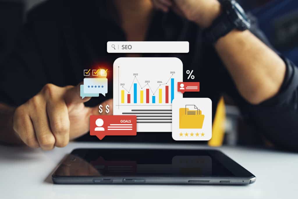 Person analysiert SEO-Daten auf Tablet mit digitalen Diagrammen – Symbolbild für effektives Lokales SEO und Online-Sichtbarkeit.