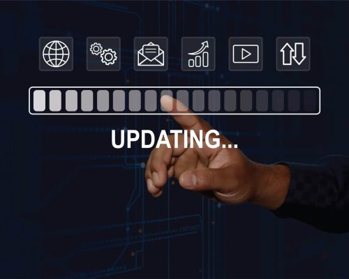 A hand interacts with a futuristic interface updating from 2024 to 2025